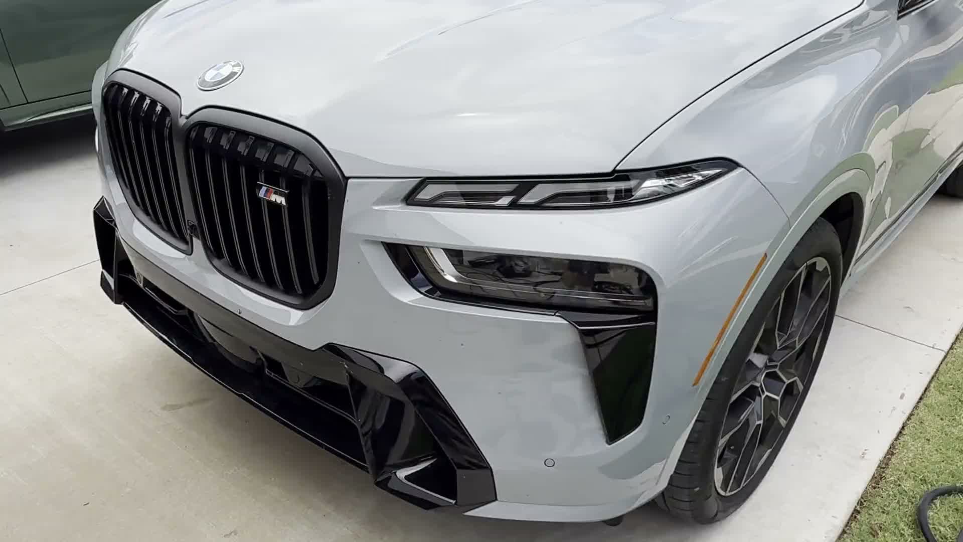 Gray BMW X7 with a mirror-gloss finish after a mobile detail in Edmond, OK